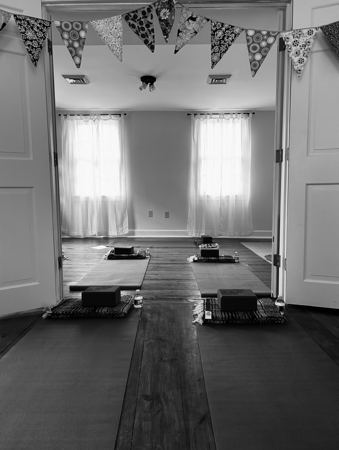 Yoga studio with mats and meditation cushions